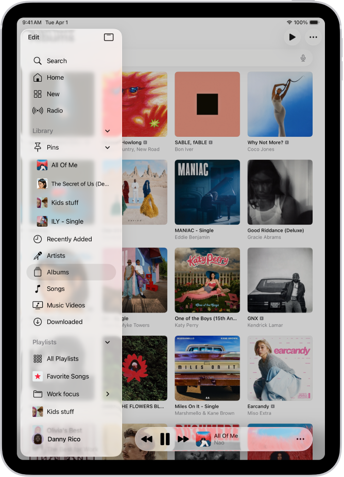 iPad ’ਤੇ ਖੁੱਲ੍ਹੀ ਸੰਗੀਤ ਐਪ ਖੱਬੇ ਪਾਸੇ ਸਾਈਡਬਾਰ ਅਤੇ ਸੱਜੇ ਪਾਸੇ ਐਲਬਮਾਂ ਦਿਖਾ ਰਹੀ ਹੈ। ਮਿਨੀ ਪਲੇਅਰ ਹੇਠਾਂ ਹੈ।