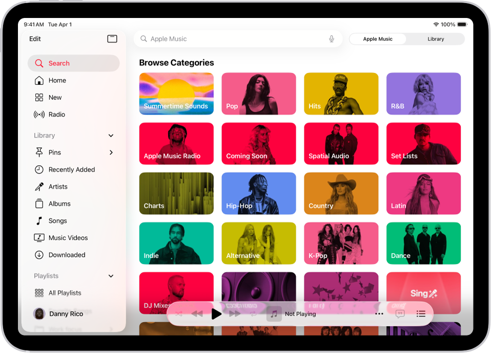 Der Tab „Suchen“ mit der Seitenleiste links und einem Suchfeld oben rechts. Unter dem Suchfeld werden verschiedene Musikkategorien anzeigt. Unten befindet sich der Mini-Player.