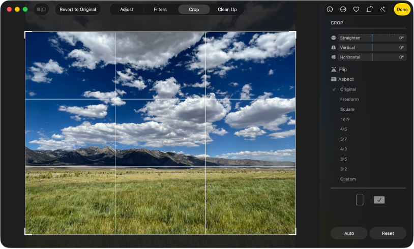 A photo in editing view, with Crop selected in the toolbar and cropping and straightening tools on the right.