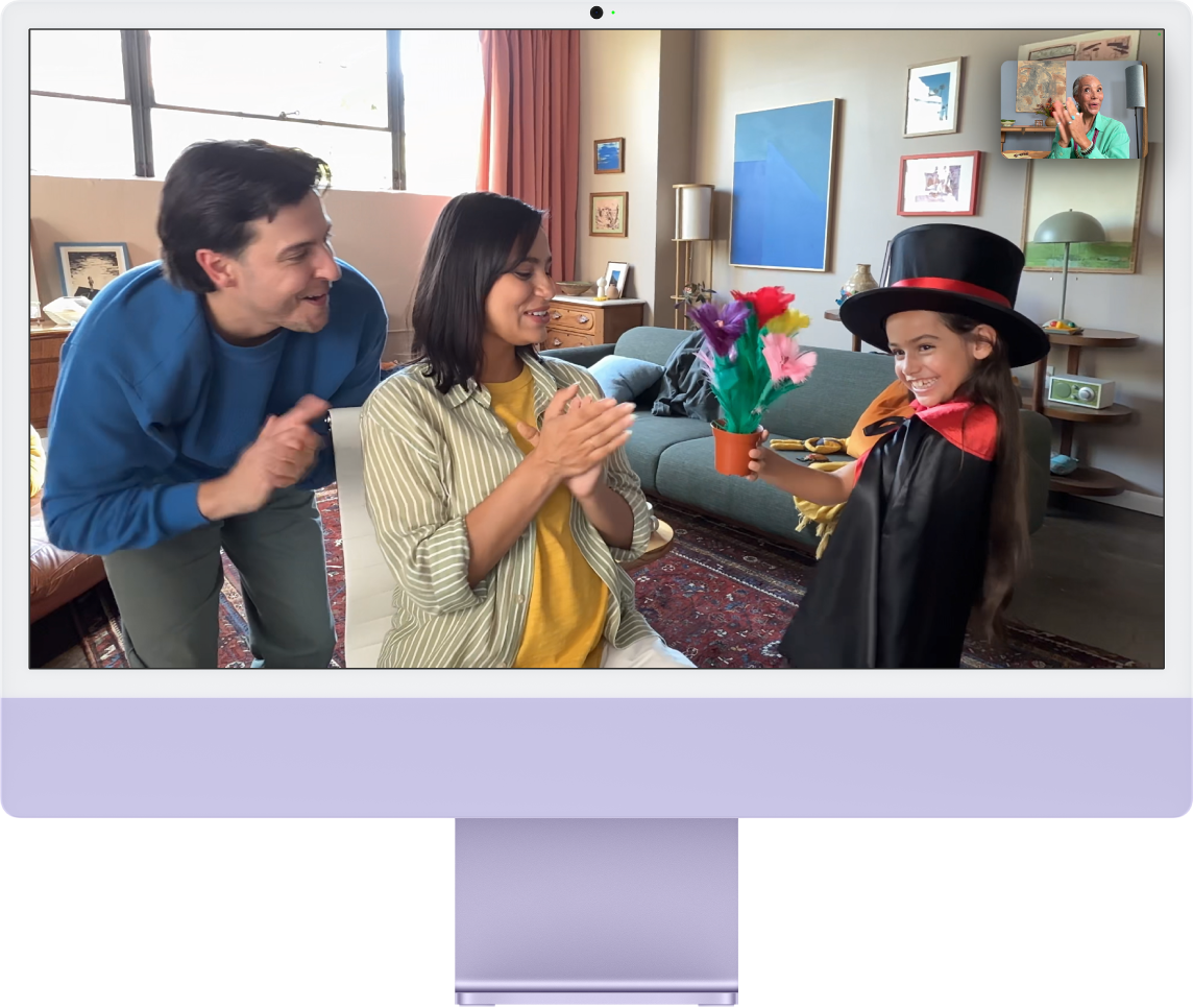 An iMac with people using Center Stage.