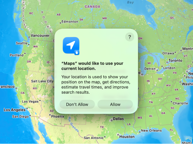 El escritorio de una Mac mostrando la app Mapas y un cuadro de diálogo donde el usuario puede permitir o impedir que Mapas use su ubicación actual.