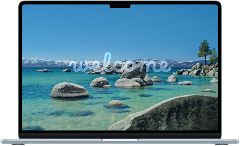An open MacBook Pro with “Welcome” on the screen.