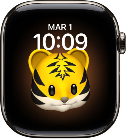 Il quadrante Memoji dove puoi modificare il tuo alter ego e una complicazione in basso. Tocca lo schermo per dare vita alla Memoji. Sullo schermo, la data e l’ora sono in alto e la complicazione Timer è in basso.