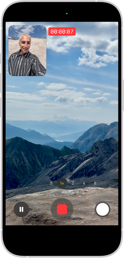 A Kamera app Videó módban egy kettős felvétel rögzítése közben. A keret bal felső részén lévő ablak azt jeleníti meg, amit az előlapi kamera rögzít, míg a keret többi részén a hátoldali kamera által rögzített kép látható.