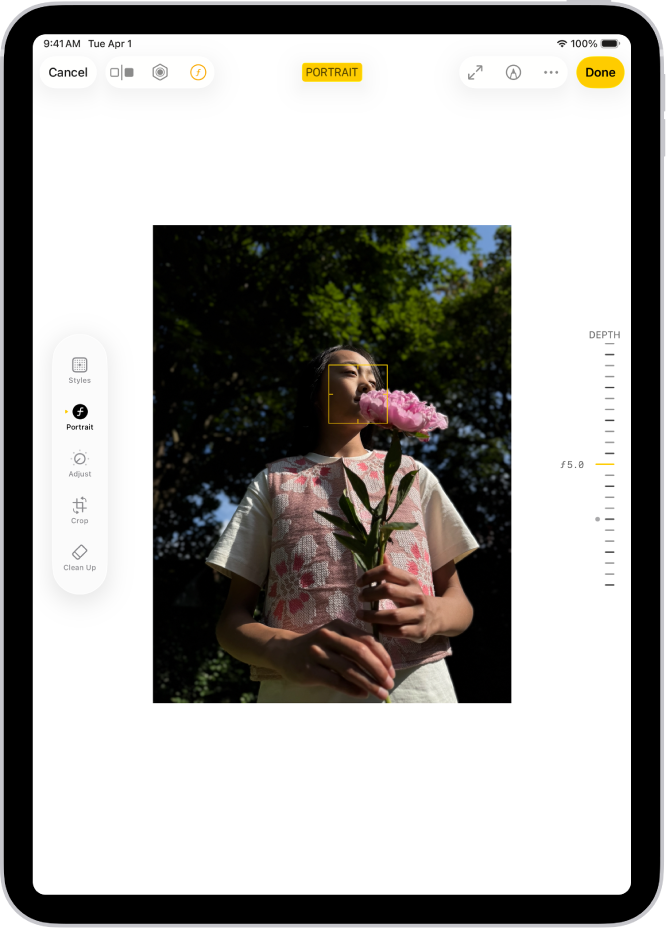 The Edit screen of a Portrait mode photo. A portrait photo is in the center of the screen. On the right side of the screen is a slider to adjust the Depth Adjustment setting. On the left side of the screen are the Portrait, Adjust, Filters, and Crop buttons. The Portrait button is selected.