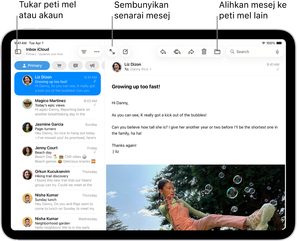 Peti Masuk Mail, dengan senarai e-mel di bahagian kiri dan e-mel terbuka di bahagian kanan.