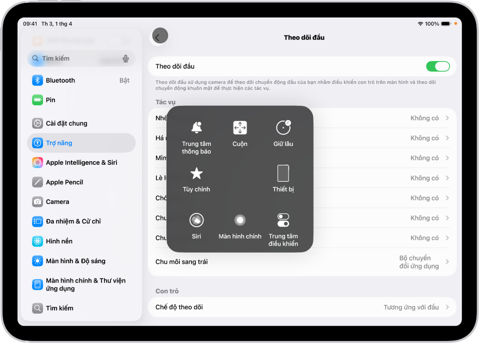Một iPad với tùy chọn theo dõi đầu được bật. Menu AssistiveTouch hiển thị, đang cho thấy các điều khiển cho Trung tâm thông báo, Cuộn, Giữ lâu, Thiết bị, Trung tâm điều khiển, Nhà, Siri và Tùy chỉnh.