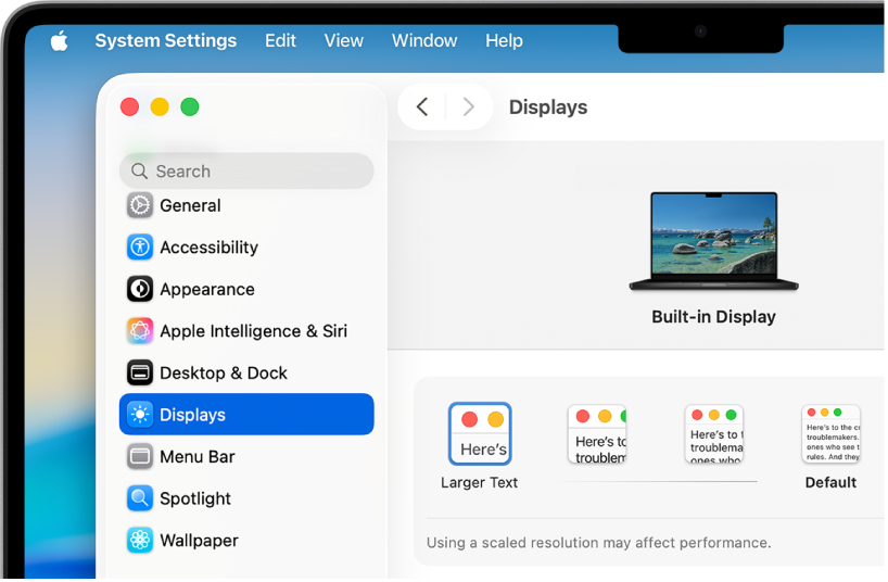 La fenêtre Réglages système est ouverte sur le bureau. L’écran utilise une résolution plus faible, de sorte que les éléments de l’interface utilisateur apparaissent plus grands.