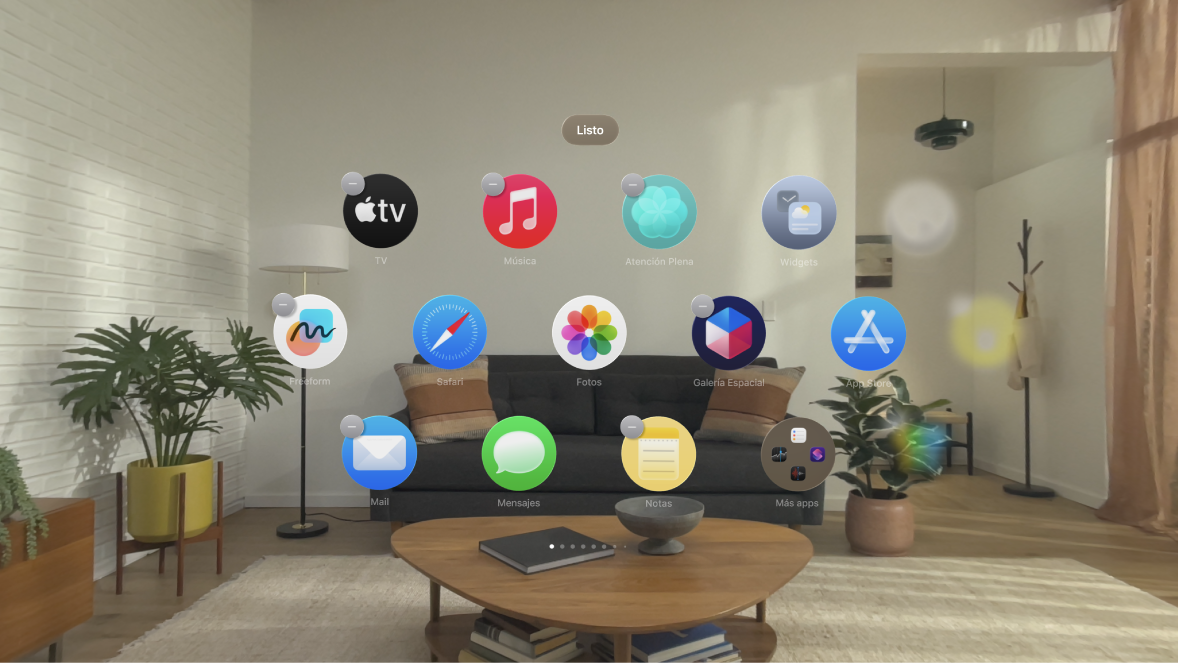 En la vista de inicio de un Apple Vision Pro, se muestran unas apps agitándose.