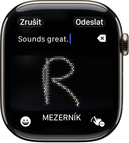 Obrazovka s textovým polem, ve kterém je vidět rukou napsané písmeno. Dole se nacházejí tlačítka Emotikony a Diktování.