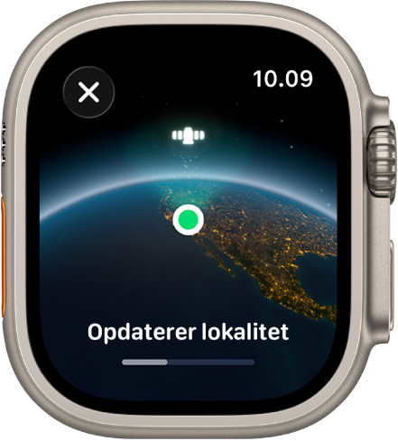 En skærm viser ”Opdaterer lokalitet” med en statuslinje og Jorden set fra rummet med en grøn prik som lokalitetsindikator.