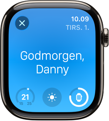 Apple Watch, der viser vækningsskærmen. Ordet Godmorgen vises foroven. Temperaturen, vejrforholdene og batteriniveauet vises nedenunder.