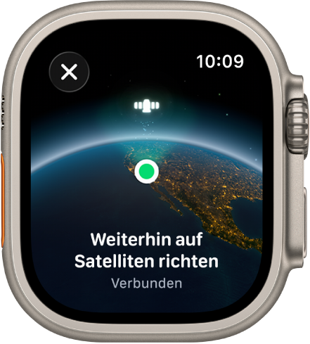 Ein Bildschirm zeigt ein Satellitensymbol über einer gewölbten Ansicht der Erde, einen grünen Verbindungsindikator und den Text „Weiterhin auf Satelliten richten“.