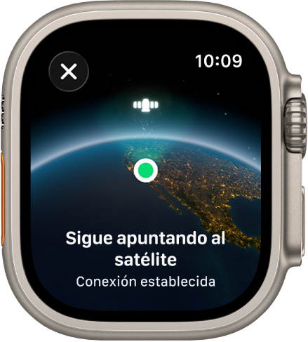Una pantalla que muestra un ícono de satélite sobre una vista curvada de la Tierra, un indicador de conexión verde y el mensaje “Continúa apuntando al satélite”.