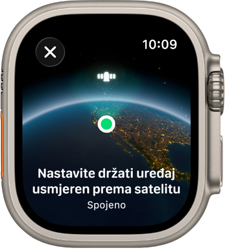 Zaslon prikazuje ikonu satelita preko zakrivljenog prikaza Zemlje, zeleni indikator veze i poruku “Nastavite držati uređaj usmjeren prema satelitu”.