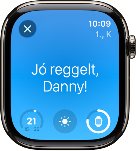Az Apple Watch az ébredési képernyővel. Felül a „Jó reggelt!” felirat olvasható. Alatta a hőmérséklet, az időjárási körülmények és az akkumulátor töltöttségi szintje látható.