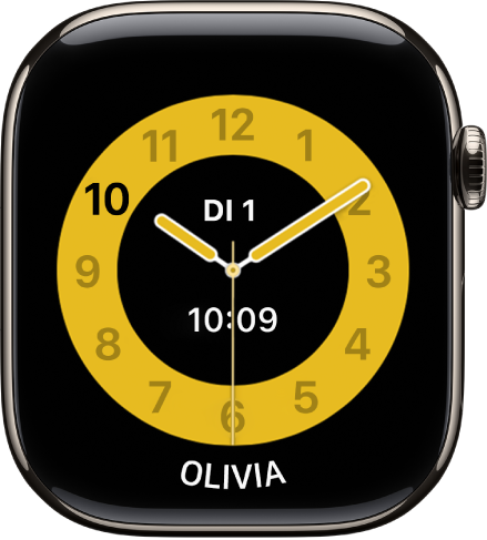 De wijzerplaat Schooltijd, met een analoge klok met in het midden de datum en digitale tijd. Onderin staat de naam van het kind dat de Apple Watch gebruikt.