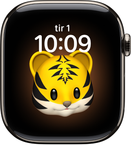 Memoji-urskiven, der du kan justere Memoji-figuren og en komplikasjon nederst. Trykk på skjermen for å animere Memojien. Dato og klokkeslett er øverst, og Nedtellinger-komplikasjonen er nederst.
