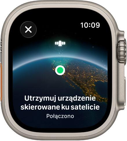 Ekran przedstawiający ikonę satelity na zakrzywionym widoku Ziemi, zielony wskaźnik połączenia i komunikat „Nadal kieruj urządzenie ku satelicie”.