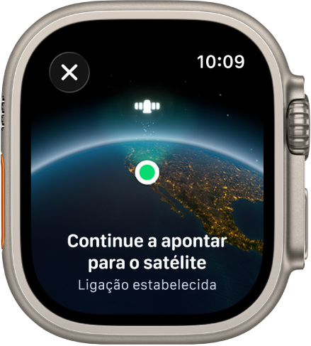 Um ecrã a mostrar um ícone de satélite sobre uma vista curva do planeta Terra, um indicador de ligação verde e o texto “Continue a apontar para o satélite”.