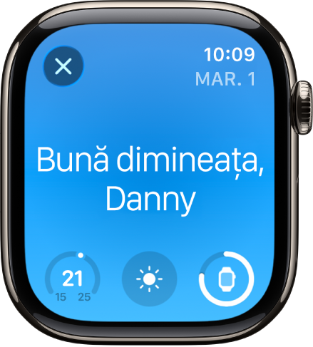 Apple Watch afișând ecranul de trezire. Cuvintele „Bună dimineața” apar în partea de sus. Temperatura, starea vremii și nivelul bateriei sunt dedesubt.