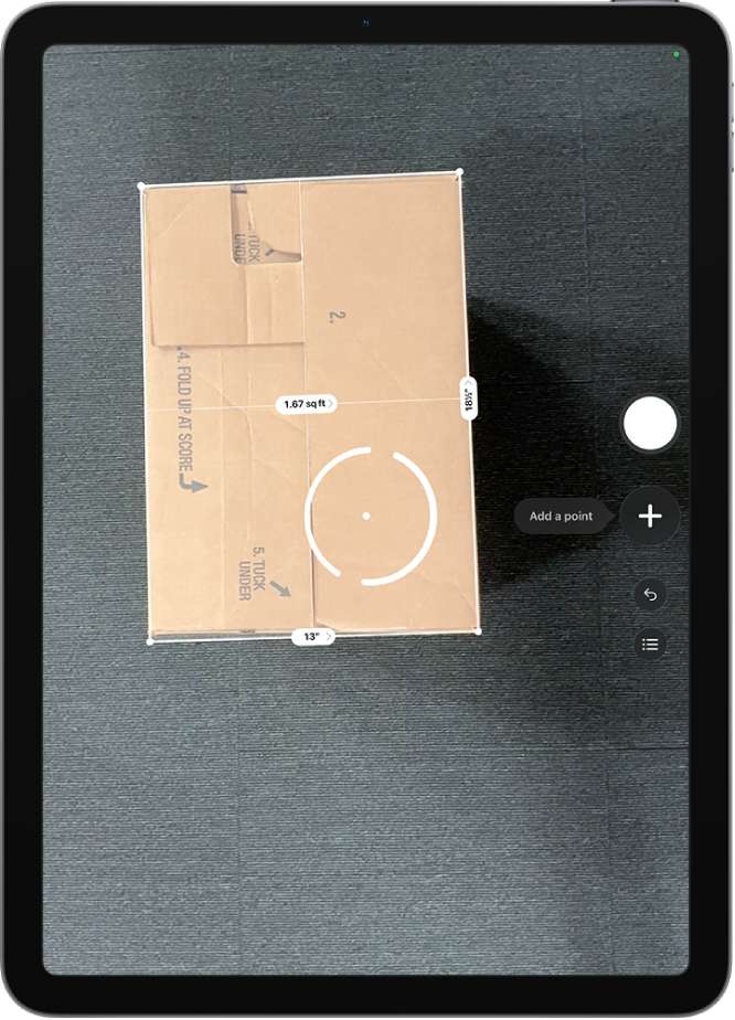 A screen showing the measurement of the dimensions of a box in the Measure app. The area of the box is calculated from the measurements of the dimensions.