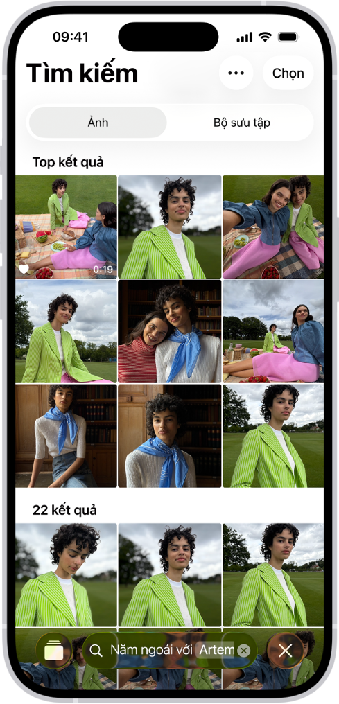 Một iPhone đang hiển thị ảnh trong ứng dụng Ảnh. Một thanh tìm kiếm với mô tả xuất hiện ở cuối màn hình.