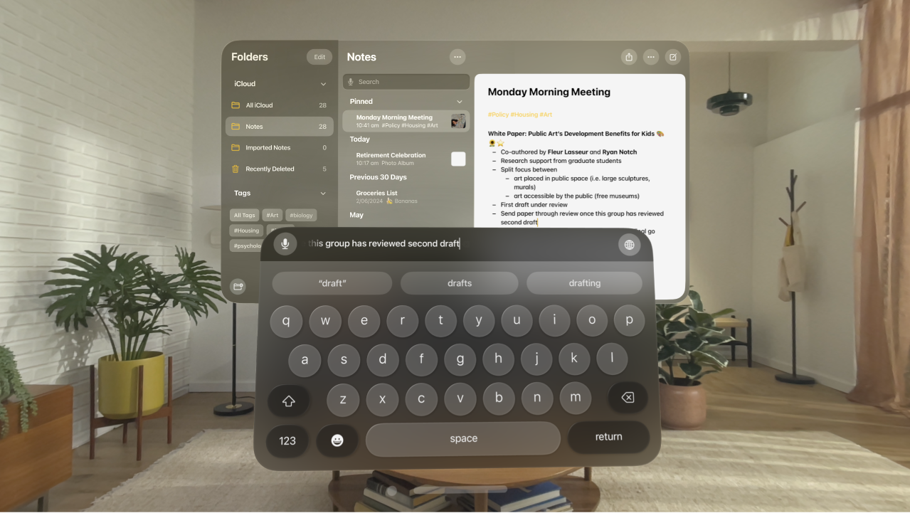 A user’s view on Apple Vision Pro. The Notes app is open, and a note is being edited with the virtual keyboard. The preview of the text being edited is visible at the top of the keyboard.