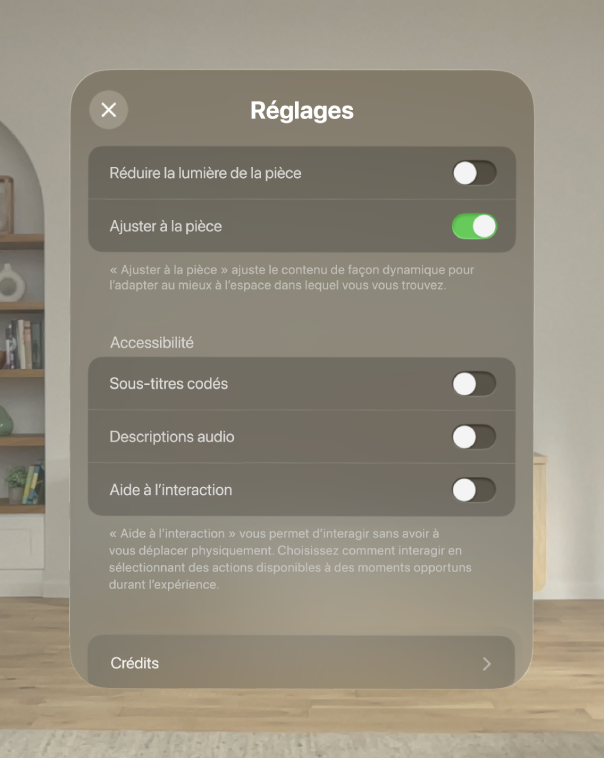 Les réglages de l’expérience À la rencontre des dinosaures, avec des options à ajuster comme Réduire la lumière de la pièce et Ajuster à la pièce, ainsi que des options à activer, comme Sous-titres codés, Descriptions audio et Aide à l’interaction.