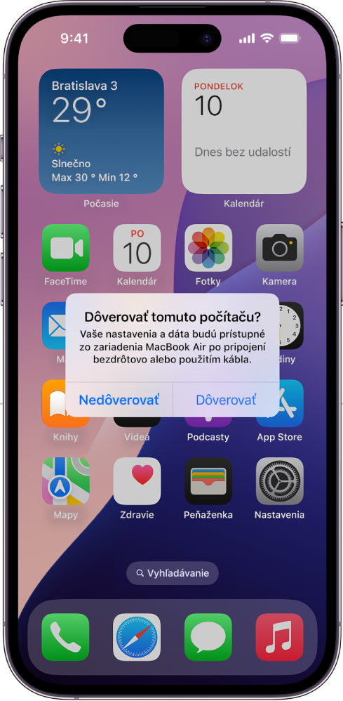 iPad s dialógovým oknom „Dôverovať tomuto počítaču?“, ktoré sa zobrazí pri prvom pripojení k MacBooku Air.