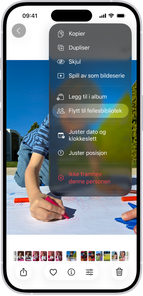 Et bilde er åpent i Bilder-appen. Øverst til høyre på skjermen vises det et alternativ for å flytte bildet til det delte biblioteket.