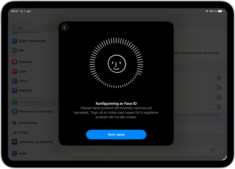 Konfigurasjonsskjermen for Face ID-gjenkjenning. Et smilefjes vises på skjermen, omsluttet av en sirkel. Teksten under informerer brukeren om å bevege hodet sakte for å fullføre sirkelen. En Kom i gang-knapp vises nær bunnen av skjermen.