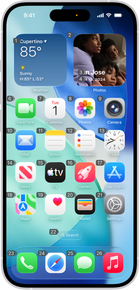 An iPhone showing a number next to each item on the Home Screen. At the top of the screen, the Voice Control command “Show numbers” is displayed.