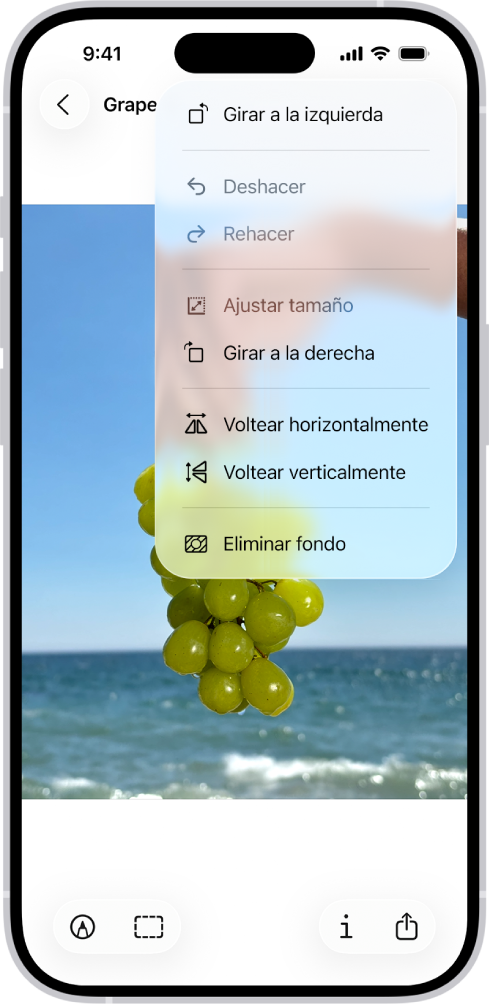 Una pantalla que muestra una imagen con uvas en primer plano. Un menú muestra la opción Eliminar fondo. En la parte inferior de la pantalla se encuentran los botones Marcado, Recortar, Información y Compartir.