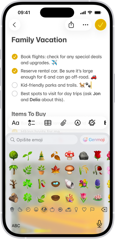 Bilješka je otvorena u aplikaciji Bilješke u gornjoj polovici zaslona, a emoji tipkovnica otvorena je u donjoj polovici zaslona.