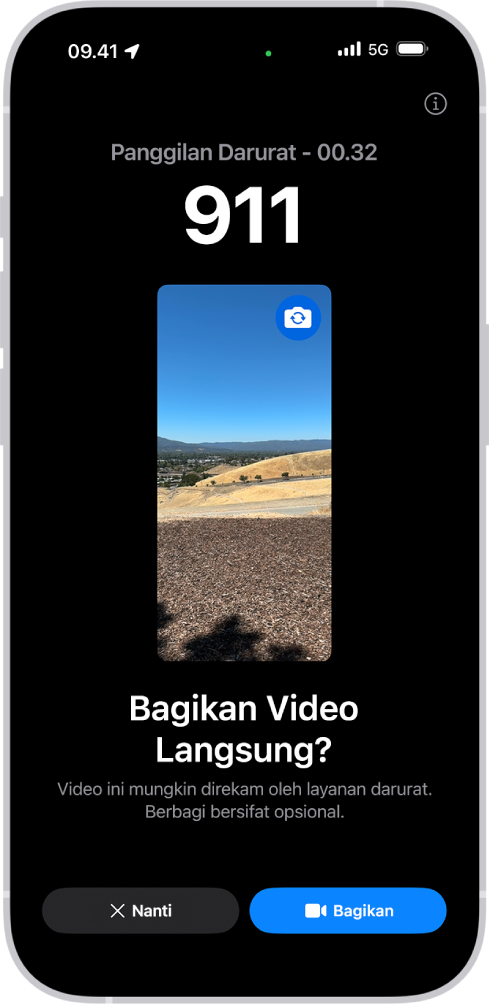 Layar Video Langsung Darurat SOS menampilkan panggilan darurat telepon 911 dengan pratinjau video di bagian tengah. Di bagian bawah terdapat tombol untuk Nanti dan Bagikan Video.