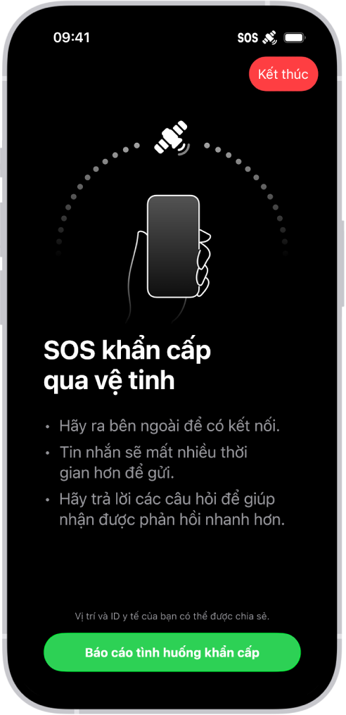 Màn hình SOS khẩn cấp, đang cho thấy rằng điện thoại được kết nối và đang hướng dẫn người dùng tiếp tục hướng vào vệ tinh. Nút Báo cáo tình huống khẩn cấp nằm ở cuối màn hình.