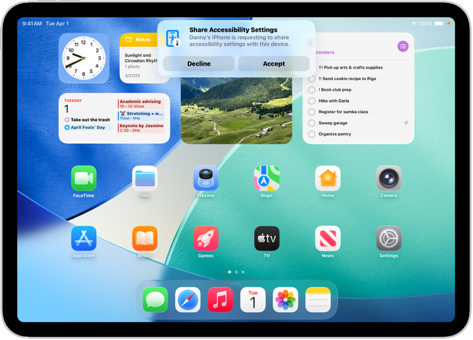 An iPad showing a notification that Danny’s iPhone is requesting to share accessibility settings.