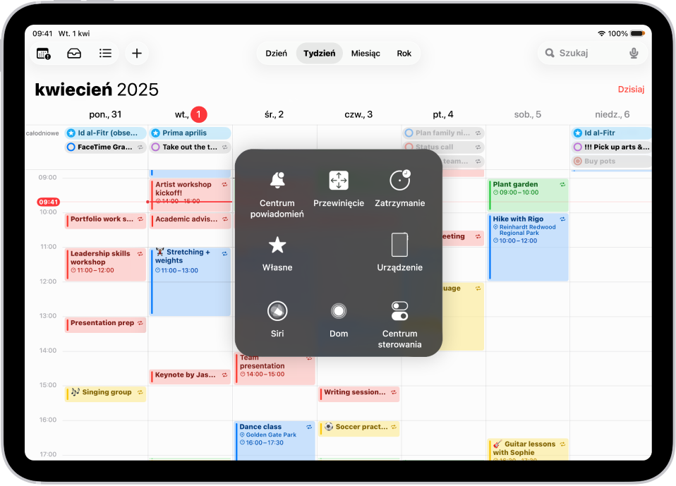iPad z wyświetlonym menu funkcji AssistiveTouch, zawierającym narzędzia: Centrum powiadomień, Urządzenie, Centrum sterowania, Główny, Siri oraz Własne.