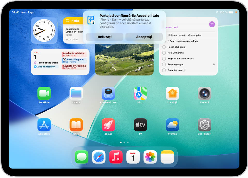 iPad afișând o notificare potrivit căreia dispozitivul iPhone - Daniel solicită să partajeze configurări de accesibilitate.