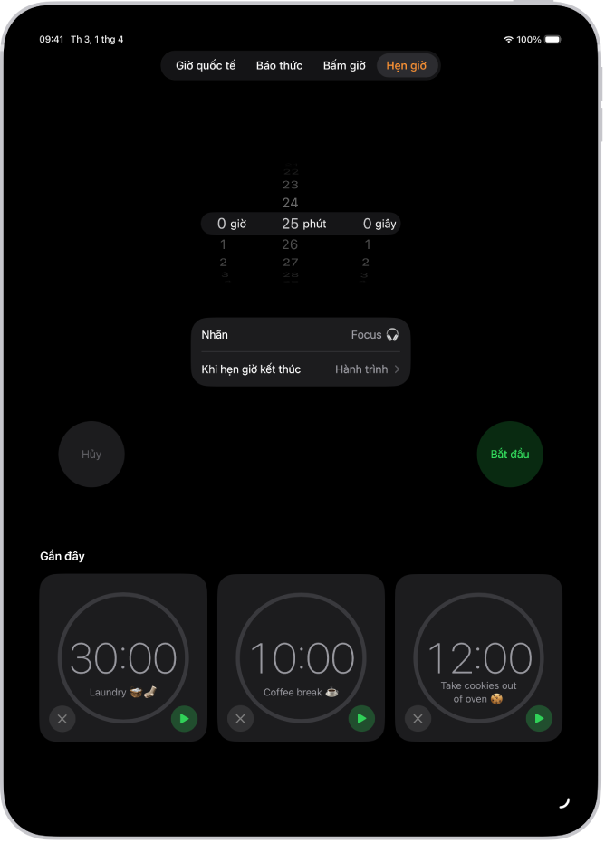 Tab Hẹn giờ đang hiển thị các cài đặt để đặt một mục hẹn giờ. Một mục hẹn giờ được tạo gần đây ở bên dưới cài đặt hẹn giờ. Các nút Giờ quốc tế, Báo thức, Bấm giờ và Hẹn giờ nằm ở dưới cùng.