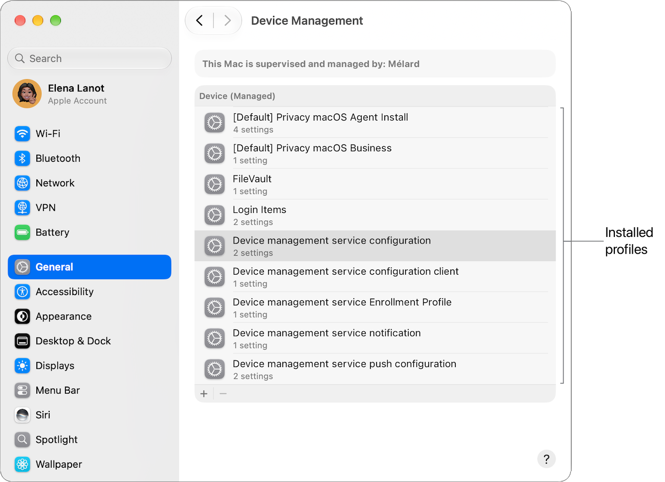The Device Management pane of System Settings on a Mac, with a label identifying the installed profiles.