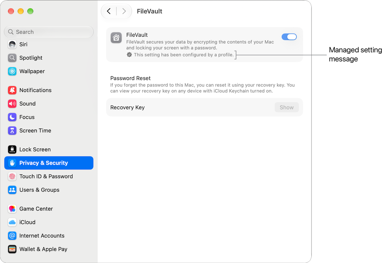 The FileVault pane of System Settings on a Mac, with FileVault turned on and a label identifying the managed setting message.