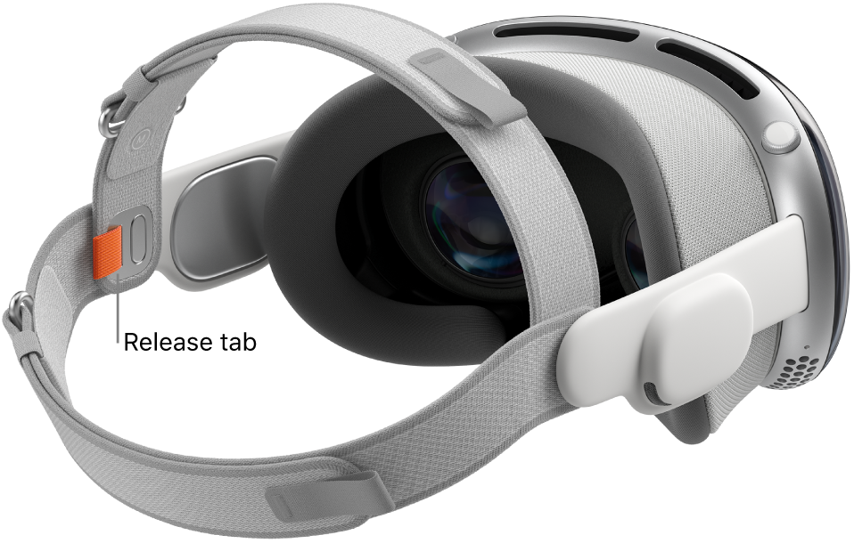 Apple Vision Pro with the Dual Loop Band attached. An orange release tab is visible on the inside of the Dual Loop Band.
