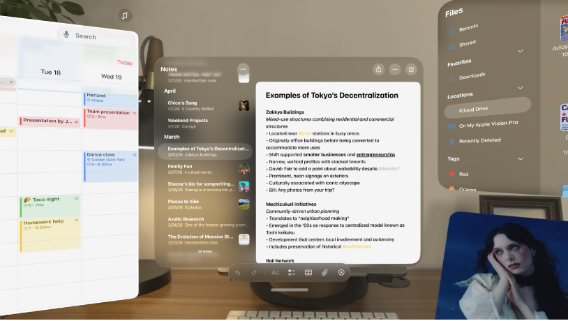 Multiple apps open on Apple Vision Pro, arranged in front of and around the user.