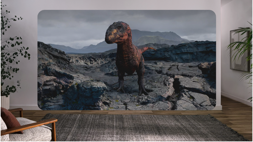 Vue d’un utilisateur sur l’Apple Vision Pro, montrant l’image d’un dinosaure provenant de l’expérience interactive « À la rencontre des dinosaures ».