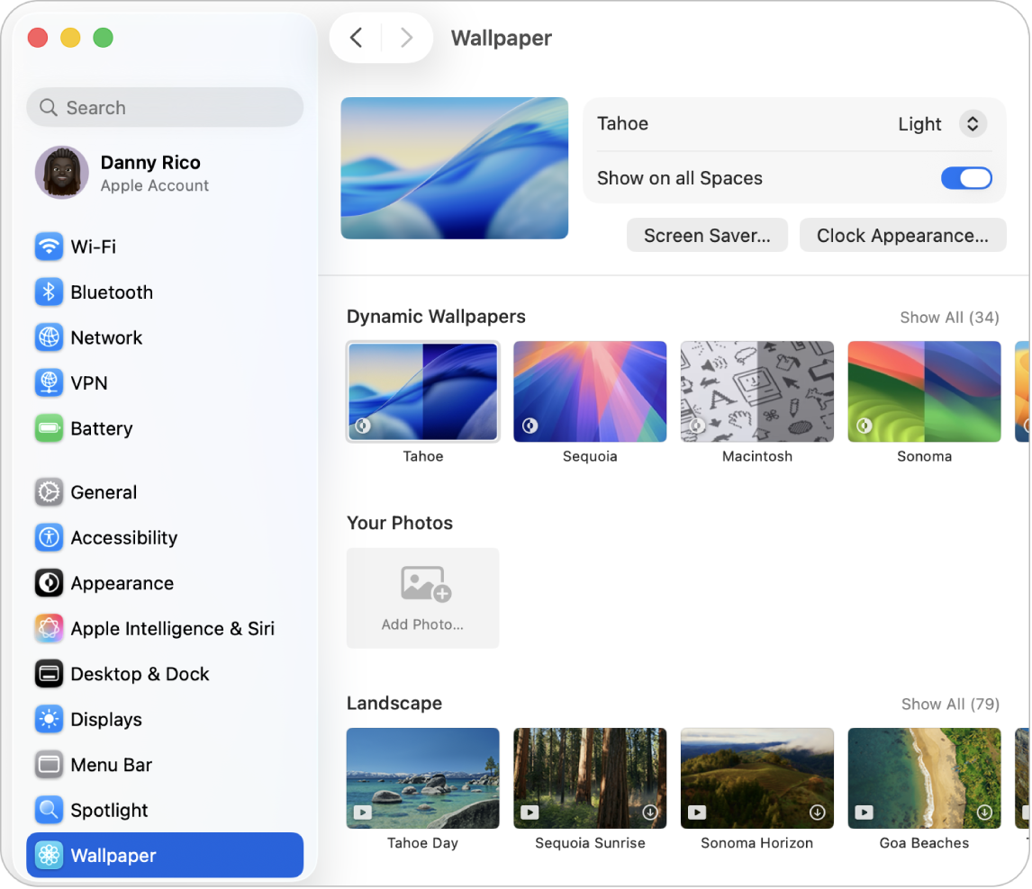 The System Settings window, with Wallpaper settings selected in the sidebar, and Tahoe Dynamic Wallpaper (Light) selected on the right.