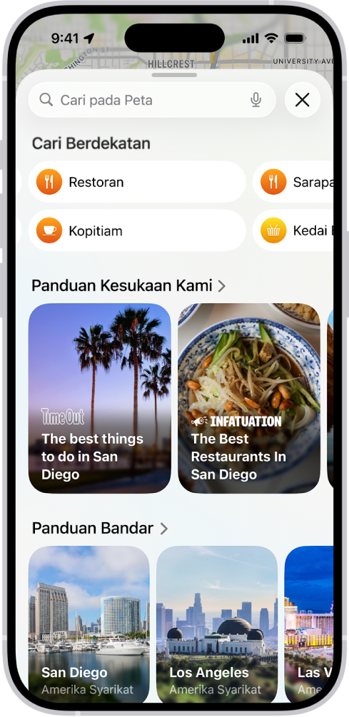 App Peta menunjukkan medan carian, kategori untuk perkhidmatan berdekatan dan panduan bandar. Di bahagian bawah skrin ialah papan kekunci atas skrin iPhone.