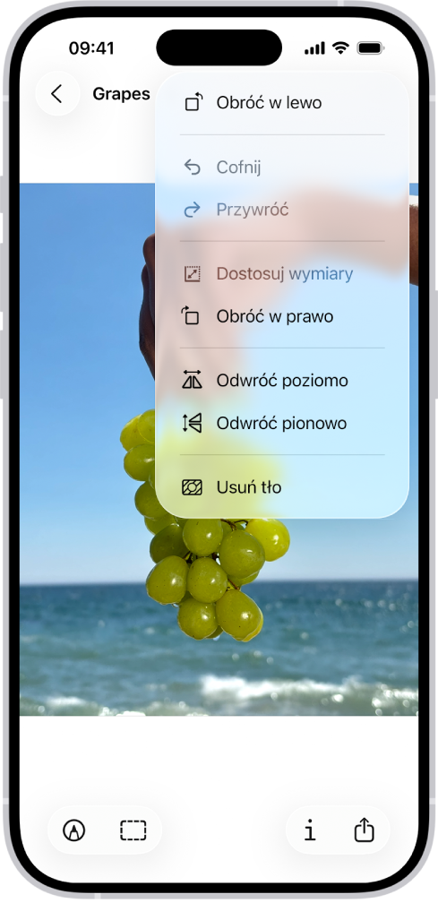 Ekran zawierający obrazek z winogronami widocznymi w tle. Wyświetlone jest menu z poleceniem Usuń tło. Na dole ekranu znajdują się przyciski: Oznaczenia, Zaznaczenie, Informacje oraz Udostępnij.