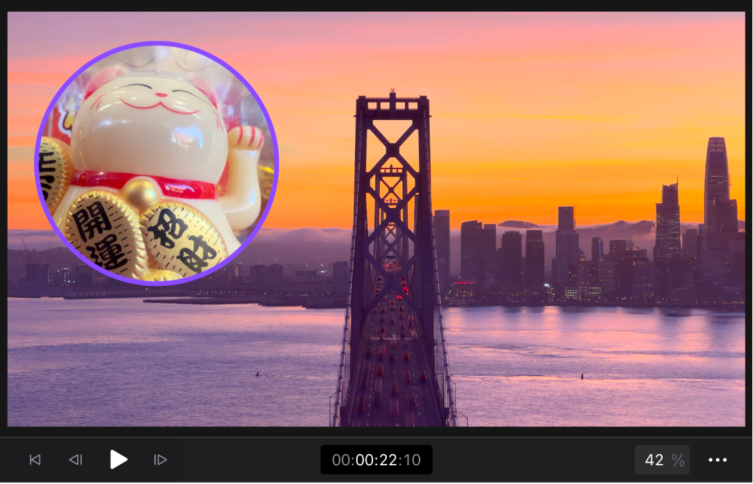 A clip of an alpha channel (beckoning cat) composited over a background clip of a cityscape.
